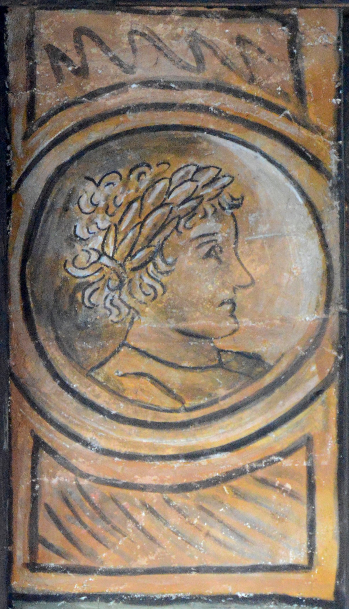 Ritratto di uomo con corona d'alloro